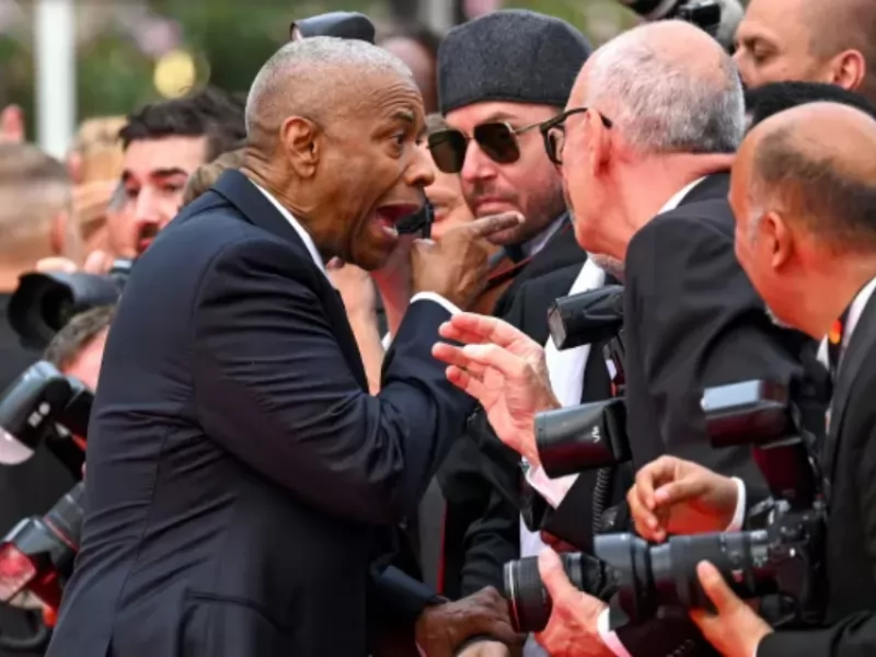 Denzel Washington litiga con un fotografo a Cannes 2025: cosa è successo sul tappeto rosso